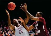  ?? ASSOCIATED PRESS ?? NORTH CAROLINA CENTRAL’S Dominique Reid (22) and Texas Southern’s Trayvon Reed (5) compete for a rebound during the second half of a First Four game of the NCAA men’s college basketball tournament Wednesday in Dayton, Ohio. Texas Southern won 64-46.