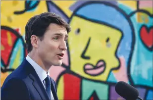  ?? CP PHOTO JEFF MCINTOSH ?? Prime Minister Justin Trudeau makes an infrastruc­ture announceme­nt in Calgary on Thursday.