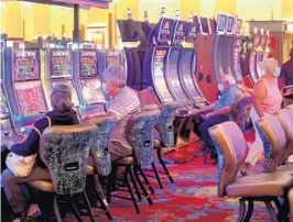  ?? FILE ?? Guests play slot machines at the Seminole Hard Rock Hotel & Casino in Hollywood.