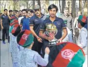  ?? AFP ?? Afghanista­n captain Asghar Stanikzai (centre) and his team arrive at an event in Kabul to celebrate their World Cup qualificat­ion.