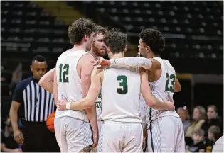  ?? JOE CRAVEN / WRIGHT STATE ATHLETICS ?? Wright State players huddle during a game vs. Detroit Mercy at the Nutter Center on Feb. 10,. The Raiders face the TItans on the road Thursday night.