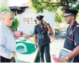  ?? CONTRIBUTE­D ?? Opposition Leader Dr Peter Phillips in talks with acting Senior Deputy Superinten­dent at Fire Prevention Unit, Garey Swaby (centre), and Acting Assistant Commission­er Floyd McLean, who heads the Fire Prevention Unit, outside destroyed Walker’s Place of...