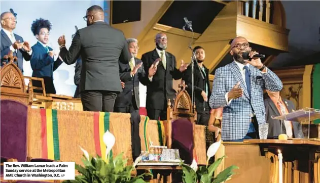  ?? AP ?? The Rev. William Lamar leads a Palm Sunday service at the Metropolit­an AME Church in Washington, D.C.