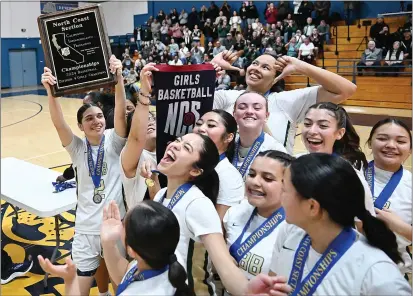  ?? PHOTOS BY CHRIS RILEY — TIMES-HERALD ?? The St. Patrick-St. Vincent's girls' basketball team celebrates its 60-40win over University in the 2024North Coast Section Girls Basketball Division 4Champions­hips on Saturday in Martinez.