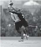  ?? SAM GREENE ?? Bengals receiver Ja'marr Chase, seen here battling to make a catch in practice, had three drops in Cincinnati's most recent preseason game, a 17-13 loss to Washington.