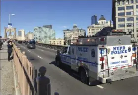  ?? TOM HAYS — ASSOCIATED PRESS ?? In this Oct. 30, 2018 photo, an NYPD emergency service vehicle brings up the rear of a heavily armed federal law enforcemen­t caravan carrying notorious Mexican drug lord Joaquin “El Chapo” Guzman back to a lower Manhattan jail following a pretrial hearing for his drug conspiracy case at a Brooklyn courthouse.
