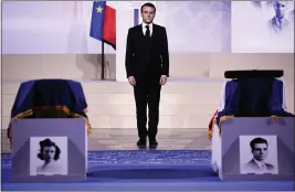  ?? CHRISTOPHE PETIT TESSON — POOL VIA AP ?? French President Emmanuel Macron pays his respects at the coffins of Missak Manouchian, and his wife Mélinée in the Pantheon monument during their induction ceremony, Wednesday, in Paris.