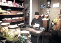  ??  ?? THE Manila Hotel’s siklesa or a motor-drawn kalesa (left); a display showing an old fashioned Chinese pharmacy at Bahay Tsinoy, which focuses on the history and role of the Chinese in the Philippine­s.