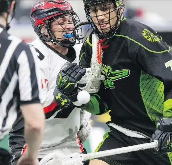  ?? KAYLE NEIS ?? Push came to shove between Vancouver’s Brendan Fowler and Saskatchew­an’s Jeremy Thompson as the Rush beat the Stealth 16-10 back on March 3, their last time out in the friendly confines of SaskTel Centre.