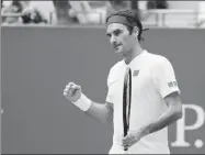  ?? KEVIN HAGEN / AP ?? Roger Federer celebrates beating Benoit Paire 7-5, 6-4, 6-4 in the second round of the US Open on Thursday.