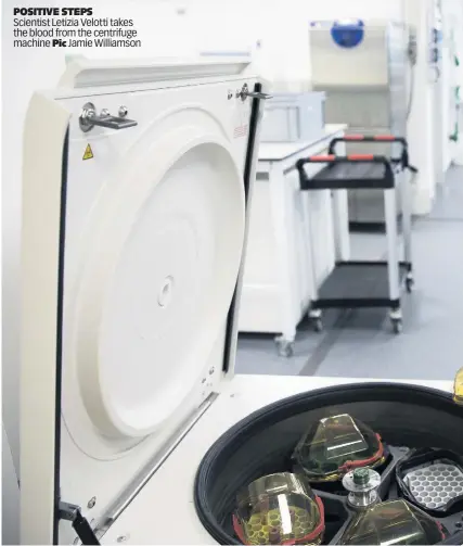  ??  ?? POSITIVE STEPS
Scientist Letizia Velotti takes the blood from the centrifuge machine Pic Jamie Williamson