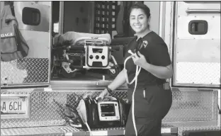  ?? COURTESY OF YRMC ?? DANIELA MENDOZA, AN EMERGENCY MEDICAL TECHNICIAN with Tri-Valley Ambulance Service, shows the cardiac monitor newly donated by the Foundation of Yuma Regional Medical Center.