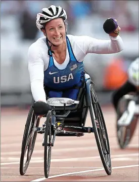  ??  ?? Easy does it: America’s Tatyana McFadden acknowledg­es the crowd after storming to her fourth world title last night