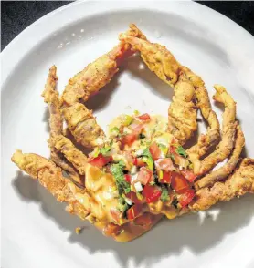  ?? Photos by Gary Fountain / Contributo­r ?? Soft shell crab appetizer at Eugene’s Gulf Coast Cuisine at 1985 Welch.