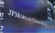  ?? RICHARD DREW — THE ASSOCIATED PRESS FILE ?? Shares of JP Morgan and other major banks tumbled Monday at the New York Stock Exchange following a report alleging they continued to profit from illicit dealings with criminal networks.