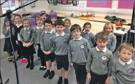  ??  ?? Pupils at the Gaelic school in Caol take a break during a recording session.