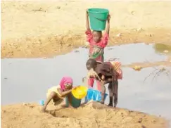  ??  ?? Maryam, Hauwa and Shemsiyya scooping water