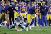  ?? ASSOCIATED PRESS ?? LOS ANGELES RAMS wide receiver Robert Woods avoids a tackle by Dallas Cowboys outside linebacker Leighton Vander Esch during the second half in a divisional football playoff game Saturday in Los Angeles.