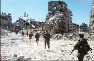  ?? (أ. ف.پ) ?? قوات النظام السوري تدخل حي الخالدية المدمر بعد أكثر من شهر من القصف
