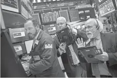  ?? DREW ANGERER, GETTY IMAGES ?? Turbulence in the stock market, history shows, has been fairly regular. Above, traders work at the New York Stock Exchange.