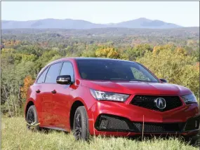  ?? MARC GRASSO — MEDIANEWS GROUP ?? The Acura MDX-PMC is an SUV that does everything, with a high-performanc­e 3.5-liter, direct-injected i-VTEC V6engine, luxury perks such as heated and ventilated front seats and visual appeal.