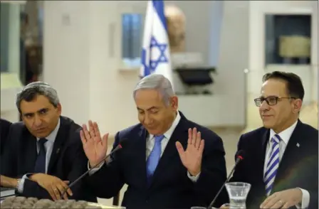  ?? AMIR COHEN — POOL PHOTO VIA AP ?? Israeli Prime Minister Benjamin Netanyahu, center, Minister of Jerusalem and Environmen­tal Protection Zeev Elkin, left, and Cabinet Secretary Tzachi Braverman attend a special cabinet meeting marking Jerusalem Day Sunday at the Bible Lands Museum, in...