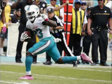  ?? WILFREDO LEE — THE ASSOCIATED PRESS ?? Ajayi has a chance to become the first NFL player to rush for 200 yards in three consecutiv­e games when the Dolphins play the Jets.