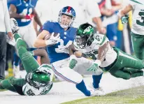  ?? COREY SIPKIN/AP ?? The Giants’ Sandro Platzgumme­r, a running back from Austria, is knocked out of bounds on a run by Jets defensive back Corey Ballentine in the second half Saturday night in East Rutherford, N.J.