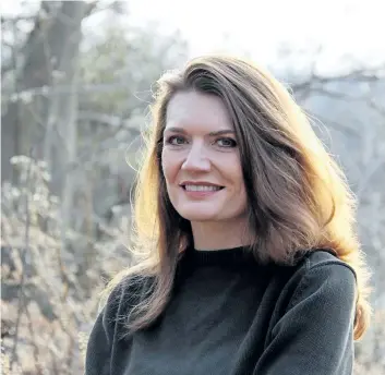  ??  ?? Author Jeannette Walls poses in this undated handout image. Walls is preparing for the reaction to her family's messy past in the film version of her bestsellin­g book The Glass Castle. The movie stars Brie Larson, Naomi Watts and Woody Harrelson.