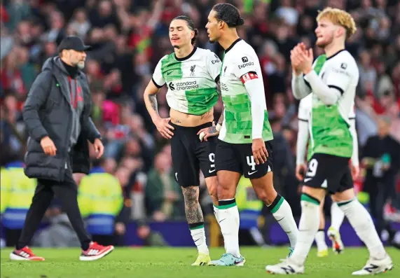  ?? ?? Hard to swallow: Liverpool players (from left) Darwin Nunez, Virgil van Dijk and Harvey Elliott are dejected at the end of a painful defeat at Old Trafford