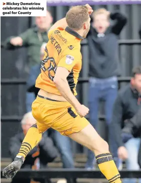  ??  ?? > Mickey Demetriou celebrates his winning goal for County