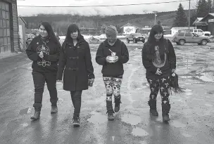  ?? RUTH FREMSON/THE NEW YORK TIMES ?? From left, Eryn Joseph, Rochelle Joseph, Tiniel Namox and Tricia Joseph walk along Highway 16 in Moricetown, Canada, on March 23. Dozens of Canadian women and girls, most of them indigenous, have vanished or turned up dead near Highway 16, so many that...