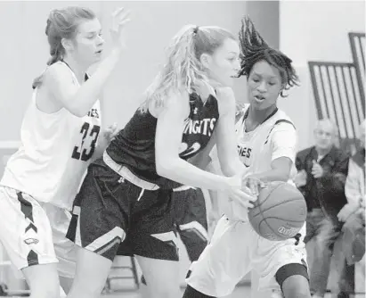  ?? KARL MERTON FERRON/BALTIMORE SUN ?? Northeast’s Divine Carter-Benson, right, steals the ball from North County’s Morgan Youngbar as Northeast teammate Caroline Makarovich, left, applies pressure. Carter-Benson led the Eagles to victory with a game-high 21 points on Friday night.