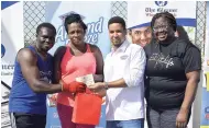  ??  ?? The Foska team was fourth in the six-set obstacle course challenge. Presenting the prizes are Jordon Harris (second right), procuremen­t manager for Shavuot Internatio­nal; and Terry Wilson (right), Gleaner’s assistant manager, business developmen­t and marketing.