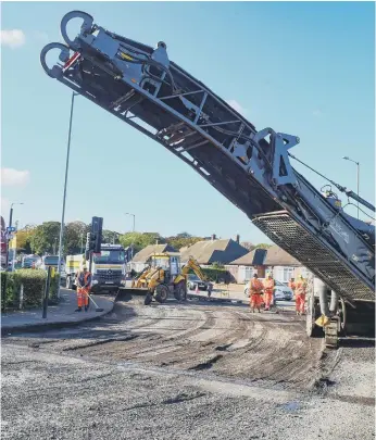  ??  ?? Resurfacin­g work taking place at the Barnes gyratory in 2019.