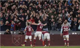  ?? London Stadium. Photograph: Tom Jenkins/The Guardian ?? West Ham players and fans celebrate their second goal in the win against Liverpool at the