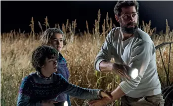  ?? A Quiet Place ?? John Krasinski with Noah Jupe and Millicent Simmonds in a scene from