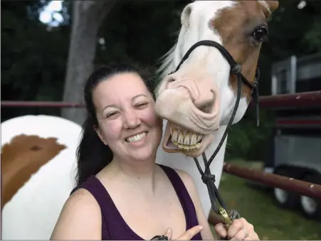  ?? BILL UHRICH — MEDIANEWS GROUP ?? Lindsey Lendo of Muhlenberg Township, a volunteer with Grey Muzzle Manor, and Marsh the horse are all smiles during the 5th annual Hops for Hooves Fundraisin­g event on at Willow Glen Park in Spring Township, Saturday, Aug. 20, 2022. Marsh lost his right eye to cancer, the operation was paid for with funds from previous benefits.