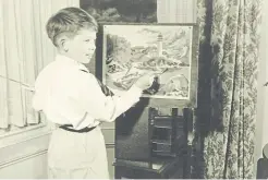  ??  ?? Anthony painting by numbers aged seven