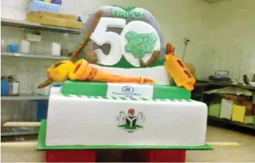  ??  ?? ‘Making this 12th foot tall cake has been my most difficult piece, yet’ Adie Vanessa Effiong & Transcorp Hilton Hotel