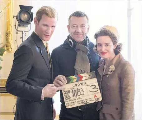  ?? Alex Bailey Netf lix ?? “THE CROWN’S” Matt Smith and Claire Foy f lank creator Peter Morgan, who says it took his team a year to map out the new episodes.