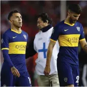  ?? — AP ?? Carlos Tevez of Boca Juniors (left) and Lisandro Lopez after their 0-2 loss against River Plate.