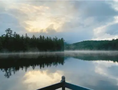  ?? MIKE HIRSCH/THE MORNING CALL ?? The sun rises over Grampus Lake in the Adirondack­s on July 4, 2021.