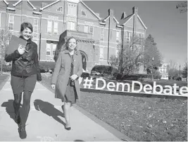  ?? SCOTT OLSON/GETTY 2015 ?? Debbie Wasserman Schultz, then chairwoman of the Democratic National Committee, right, on the campus of Drake University in Des Moines, Iowa, before a presidenti­al debate