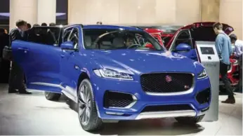  ?? ODD ANDERSEN/AFP/GETTY IMAGES ?? In its 80-year history, this is Jaguar’s first foray into the SUV segment, and the 2017 F-PACE is aimed straight at rival, the Porsche Macan. It’s sleek with sports car styling cues combined with some off-road credibilit­y.