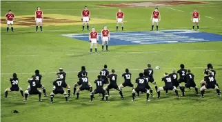  ??  ?? In this June 25, 2005 file photo, the British and Irish Lions Captain Brian O'Driscoll, center, stands with his teammates as they watch the All Blacks perform a haka prior to the start of the first rugby union Test at Lancaster Park in Christchur­ch,...