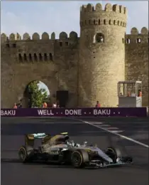  ?? IVAN SEKRETAREV, THE ASSOCIATED PRESS ?? Mercedes driver Nico Rosberg steers his car to win the Formula One Grand Prix of Europe at the Baku circuit in Baku, Azerbaijan, on Sunday.