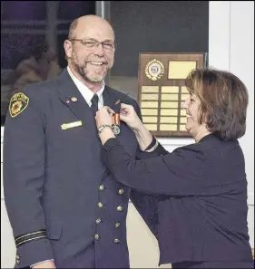  ?? CODY MCEACHERN/TRURO DAILY NEWS ?? Karen Casey, MLA for North Colchester, was one of the guest speakers at the North River Fire Brigade’s 45th anniversar­y banquet on Saturday. After her speech, she presented Trevor Janes with an award and medal for his 20 years of service to the brigade.