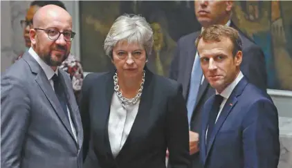  ?? SPENCER PLATT GETTY IMAGES AGENCE FRANCE-PRESSE ?? Le premier ministre belge, Charles Michel, la première ministre britanniqu­e, Theresa May, et le président français, Emmanuel Macron, attendent l’arrivée du président américain, Donald Trump, à la rencontre du Conseil de sécurité de l’ONU.