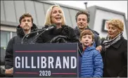  ?? DREW ANGERER / GETTY IMAGES ?? Sen. Kirsten Gillibrand (D-NY) is surrounded by family Wednesday as she threw her hat into the crowded field of Democrats who want the chance to take on President Donald Trump in 2020.